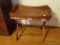 (UPSIT) BUTLER TRAY END TABLE; WOODEN BUTLER TRAY TOP WITH SIDE HANDLES SITTING ON A CREAM AND BROWN