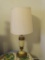 (BR) CERAMIC TABLE LAMP; CREAM AND BRONZE FINISH TABLE LAMP WITH LEAF AND FAN DETAILING. COMES WITH