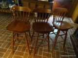 (DEN) LOT OF WOODEN SWIVEL BAR STOOLS; 3 PIECE LOT OF BANNISTER BACK BAR STOOLS THAT SIT ON A