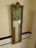 (KIT) ANTIQUE WALL MIRROR; SLIM WALL MIRROR WITH VICTORIAN BALLROOM SCENE AT THE TOP. FRAMED IN A