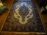 (UPSIT) LARGE AREA RUG; MACHINE MADE BURGUNDY, NAVY, CREAM, GREEN, AND TAN FLORAL AREA RUG WITH