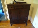 (UPSIT) DARK WOOD WARDROBE; GALLERY BACK, WITH 2 THIN CENTER DOVETAIL DRAWERS WITH A DRAWER ON