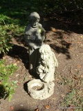(OUT) GARDEN SCULPTURES; SET OF 2 COMPOSITE GARDEN SCULPTURES. ONE IS A LITTLE GIRL WITH WATERING