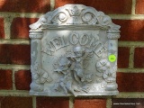 (OUT) WELCOME SIGN; WHITE CHIPPY PAINTED WELCOME SIGN WITH CHERUB ANGELS AND HIBISCUS FLOWERS.