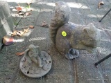 (OUT) SQUIRREL STATUE; FADED BLACK SOLID CEMENT SQUIRREL STATUE. MEASURES 8 IN X 2 IN X 8 IN.