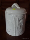 (DEN) OVER AND BACK INDOOR OUTFITTERS CANISTER; WHITE CANISTER WITH A LID THAT HAS A FAN DETAILED