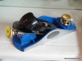 KOBALT PLANE; BLUE AND BLACK 7-IN ADJUSTABLE BLOCK PLANE. GRAY, CAST-IRON BASE WITH PRECISION-GROUND