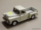 CHEVROLET MODEL TRUCK; DIE CAST WHITE 1955 CHEVY STEPSIDE TRUCK WITH OPENING DOORS AND A DROP DOWN