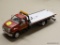 MODEL TOW TRUCK; RED AND SILVER FIRST GEAR RECOVERY DIECAST TOW TRUCK WITH AN EXTENDING BED. THE