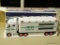 HESS TOY TRUCK AND RACECARS; HESS 2003 TOY TRUCK WITH REAL HEAD AND TAIL LIGHTS AND TWO RACE CARS