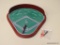 MINIATURE BASEBALL GAME; BASEBALL GAME ON A RED WOODEN BOARD WITH A BACK RIM. ONE OF THE GAME PIECES