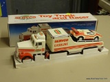 SERVCO TOY TRUCK AND RACER; SERVCO 1992 TOY TRUCK AND RACER WITH HEAD AND TAIL LIGHTS AND A RACER