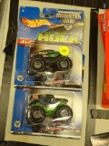 LOT OF HOT WHEELS MONSTER JAM TRUCKS; 2 PIECE LOT OF MONSTER JAM TRUCKS TO INCLUDE THE GRAVE DIGGER