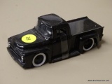 FORD MODEL PICKUP TRUCK; JADA TOYS 1956 FORD BLACK F-100 PICKUP WITH WHITE RIMS, A COVERED BED, AND