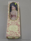 COLLECTIBLE DOLL; THE PORCELAIN ANTIQUE DOLL COLLECTION VICTORIAN THEME DOLL IN A PINK AND LACE