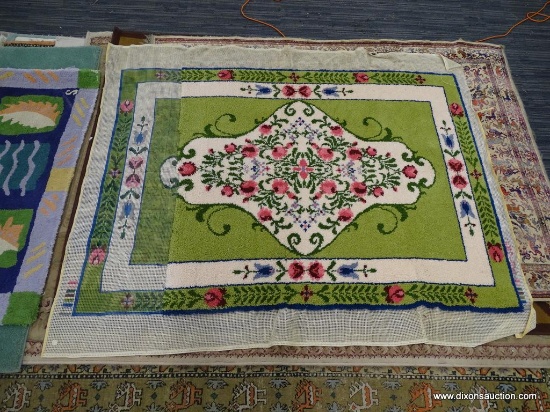 PARTIALLY WOVEN RUG; SAGE GREEN, AND CREAM COLORED RUG WITH BLUE AND PINK FLOWERS. THIS IS A