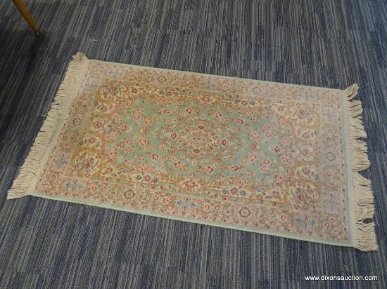 RUG; BEAUTIFUL HAND KNOTTED FLORAL RUG IN HUES OF MINT GREEN, CREAM, BLUE AND PINK. HAS FRINGE