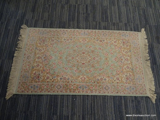 RUG; BEAUTIFUL HAND KNOTTED FLORAL RUG IN HUES OF MINT GREEN, CREAM, BLUE AND PINK. HAS FRINGE