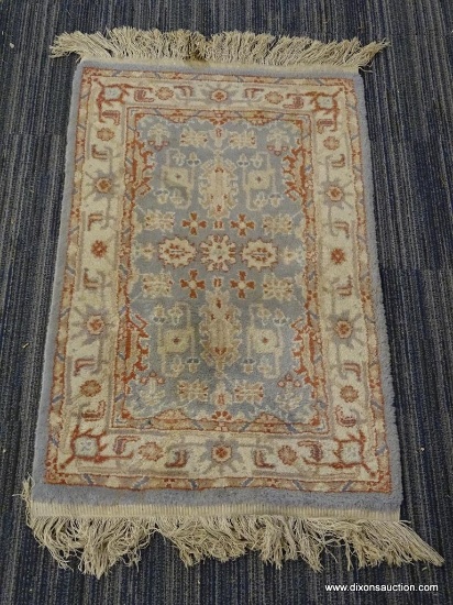 SILK ROAD HAND KNOTTED RUG; 100% WOOL PILE HAND MADE. CREAM & LIGHT BLUE WITH ORANGE HIGHLIGHTS. HAS