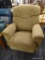 (R2) RECLINING ARM CHAIR; BROWN FABRIC ARM CHAIR THAT HAS A HANDLE FOR RECLINING ON THE RIGHT SIDE.