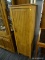 (R3) WOODEN CABINET; WOODGRAIN CABINET WITH 1 PANELED DOOR THAT HAS A LEAF DETAILED METAL HANDLE,