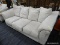 (R3) ROLL ARM SOFA; 3 CUSHIONED ROLL ARM SOFA WITH A CREAM FABRIC. IN DECENT CONDITION. MEASURES 7