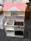 (R4) DOLL HOUSE; 2 SIDED DOLL HOUSE, ONE SIDE IS A KITCHEN WITH AN OVEN, MICROWAVE, AND A SINK, THE