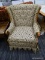 (R4) WINGBACK ARM CHAIR; ARM CHAIR ON A SWIVEL WITH A WINGED BACK AND A BEIGE FABRIC WITH BLUE AND