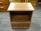 (R4) WOODEN NIGHTSTAND; MAHOGANY NIGHTSTAND WITH A ROUND EDGE TABLE TOP THAT SITS ABOVE A