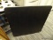 (BACKWALL) FOLDING TABLE; BLACK SQUARE FOLDING TABLE WITH A PADDED TOP. MEASURES 2 FT 9.5 IN X 2 FT