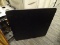 (BACKWALL) FOLDING TABLE; BLACK SQUARE FOLDING TABLE WITH A PADDED TOP. MEASURES 2 FT 9.5 IN X 2 FT