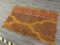 (R6) MODERN AREA RUG; BROWN, GOLD AND RED FLORAL PATTERN AREA RUG. IS IN EXCELLENT CONDITION AND