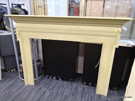 VINTAGE FIREPLACE MANTELS; CREAM/PALE YELLOW COLORED WOODEN MANTEL WITH DENTAL MOLDING AROUND THE