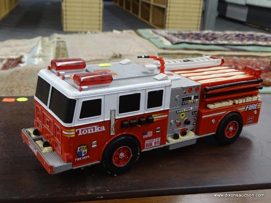 TONKA FIRE TRUCK; VINTAGE MODEL FIRE TRUCK WITH 4 BUTTONS ON THE SIDES THAT MAKE SIREN SOUND