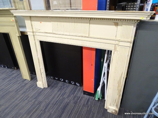 VINTAGE FIREPLACE MANTEL; CREAM COLOR WOODEN MANTEL WITH DENTAL MOLDING AROUND THE TOP, AND A COLUMN