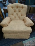 ACCENT CHAIR; ACCENT ARMCHAIR ON A SWIVEL WITH AN ORANGE AND PEACH FLORAL DETAILED FABRIC AND ARM