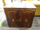 (R2) WOODEN END TABLE; DARK STAINED WOODEN END TABLE WITH 2 LOWER CABINET DOORS THAT HAVE A LOCKING