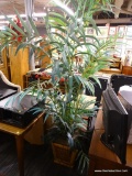 (R2) DECORATIVE FAUX PLANT; FAUX TREE IN A LARGE WOVEN BASKET. MEASURES AROUND 7 - 8 FT TALL.