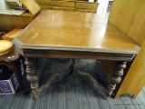 (R2) KITCHEN TABLE; WOODEN KITCHEN TABLE TURNED TAPERED LEGS WITH BALL FEET AND A SPLIT X STRETCHER.