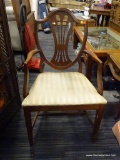 (R2) ARM CHAIR; WOODEN SHIELD BACK ARM CHAIR WITH A STRIPED CLOTH CUSHION, REEDED DETAILED ARMS, AND