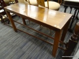 (R4) WOODEN COFFEE TABLE; WOOD GRAIN TABLE WITH 4 BLOCK LEGS. MEASURES 4 FT X 1 FT 3 IN X 2 FT 2 IN.
