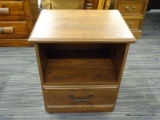 (R4) WOODEN NIGHTSTAND; MAHOGANY NIGHTSTAND WITH A ROUND EDGE TABLE TOP THAT SITS ABOVE A