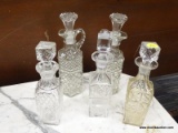 (R4) LOT OF GLASS DECANTERS; 5 PIECE LOT OF GLASS DECANTERS WITH STOPPERS TO INCLUDE 2 MATCHING