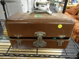 (R5) METAL TOOL BOX; BROWN METAL TOOL BOX WITH A LOCKING FRONT LATCH AND A LID THAT OPENS TO REVEAL