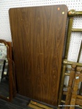 (BACKWALL) FOLDING TABLE; 5 FT DARK WOOD FOLDING TABLE. HAS SOME DENTS AND SCRATCHES. SC 964.