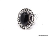 (SHOW) LADIES GERMAN SILVER RING; OVAL BLACK ONYX AND GERMAN SILVER RING. SIZE 9.