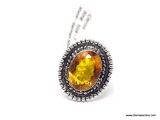 (SHOW) LADIES GERMAN SILVER RING; DARK YELLOW OVAL SHAPED CITRINE AND GERMAN SILVER RING. SIZE 7.