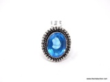 (SHOW) LADIES GERMAN SILVER RING; OVAL SHAPED BLUE TOPAZ AND GERMAN SILVER RING. SIZE 7.