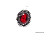 (SHOW) LADIES GERMAN SILVER RING; OVAL SHAPED GARNET AND GERMAN SILVER RING. SIZE 6.
