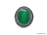 (SHOW) LADIES GERMAN SILVER RING; LARGE OVAL SHAPED GREEN ONYX AND GERMAN SILVER RING. SIZE 6.